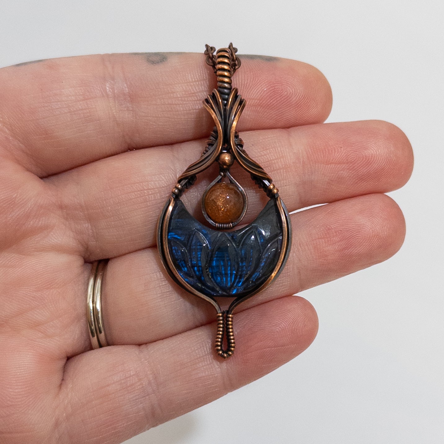 Euphoria - Lotus Carved Labradorite Crescent Moon & Sunstone Copper Pendant