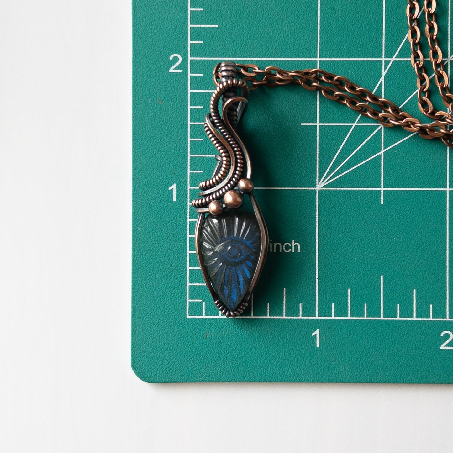 Labradorite With Carved Eye Motif & Copper Wrapped Pendant