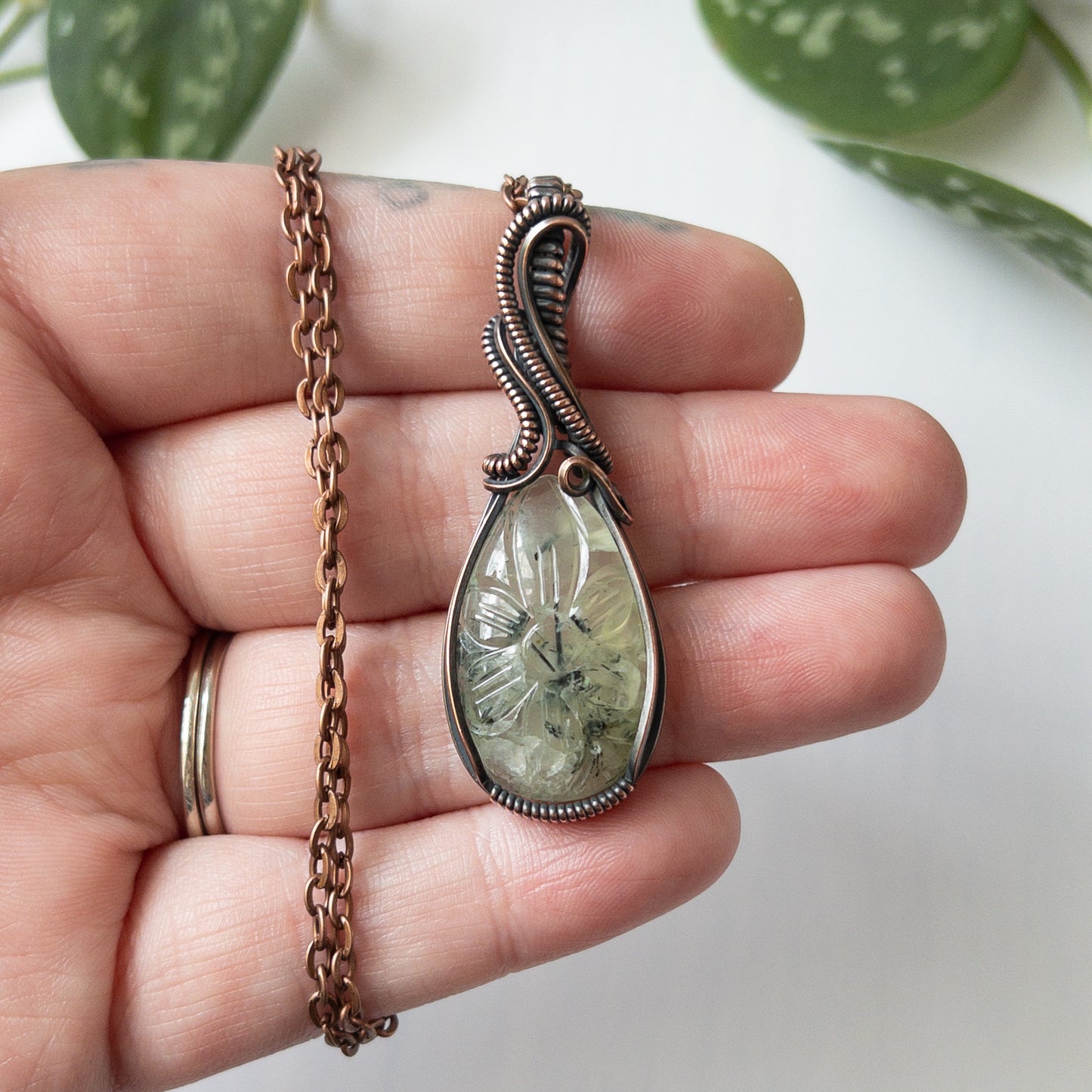 Prehnite With Carved Flower Motif & Copper Wrapped Pendant