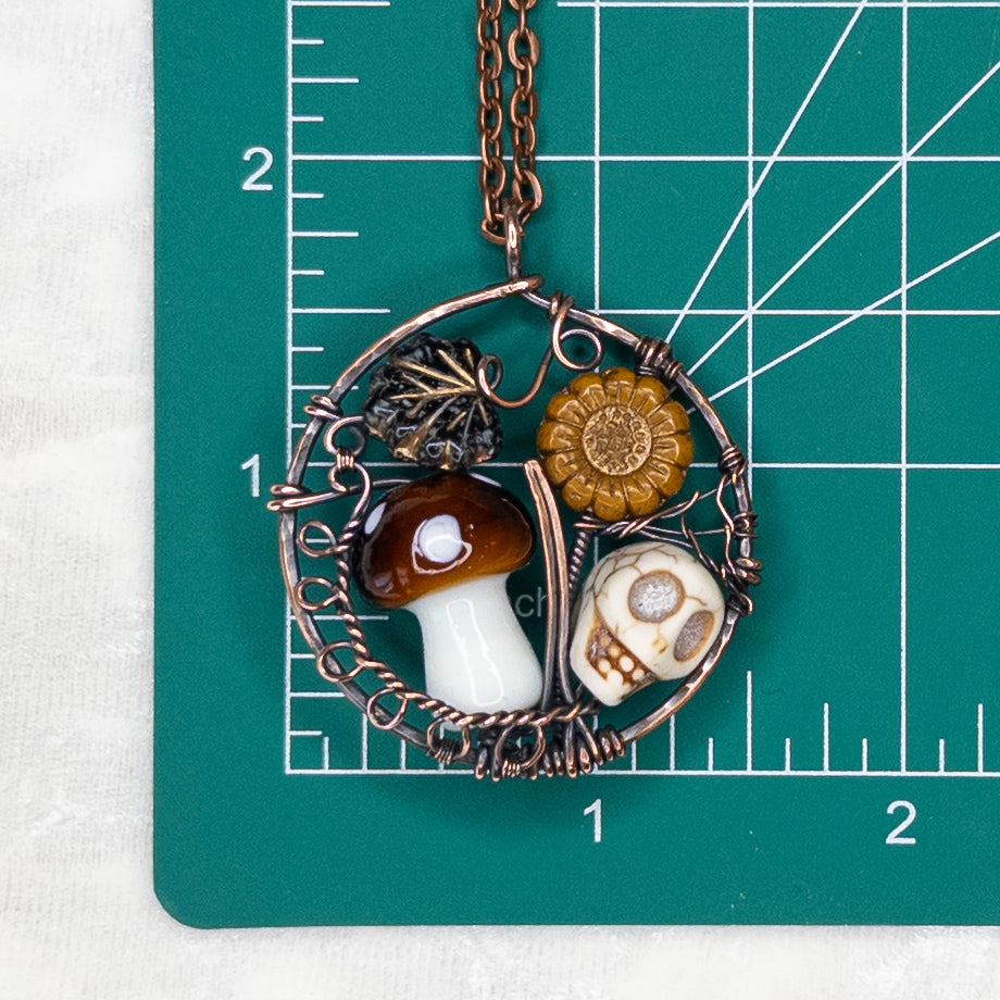 “Autumn Rest” V.2 Antiqued Copper Pendant With Czech Glass Botanical Beads, Lampwork Mushroom Bead, Stone Skull Bead, & Tiny Spiderweb