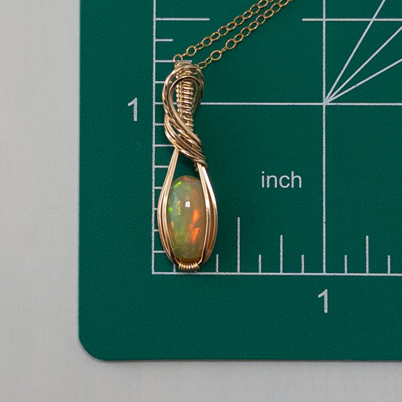 2.25 Carat Peachy Ethiopian Opal 14k Gold Filled Wrapped Pendant