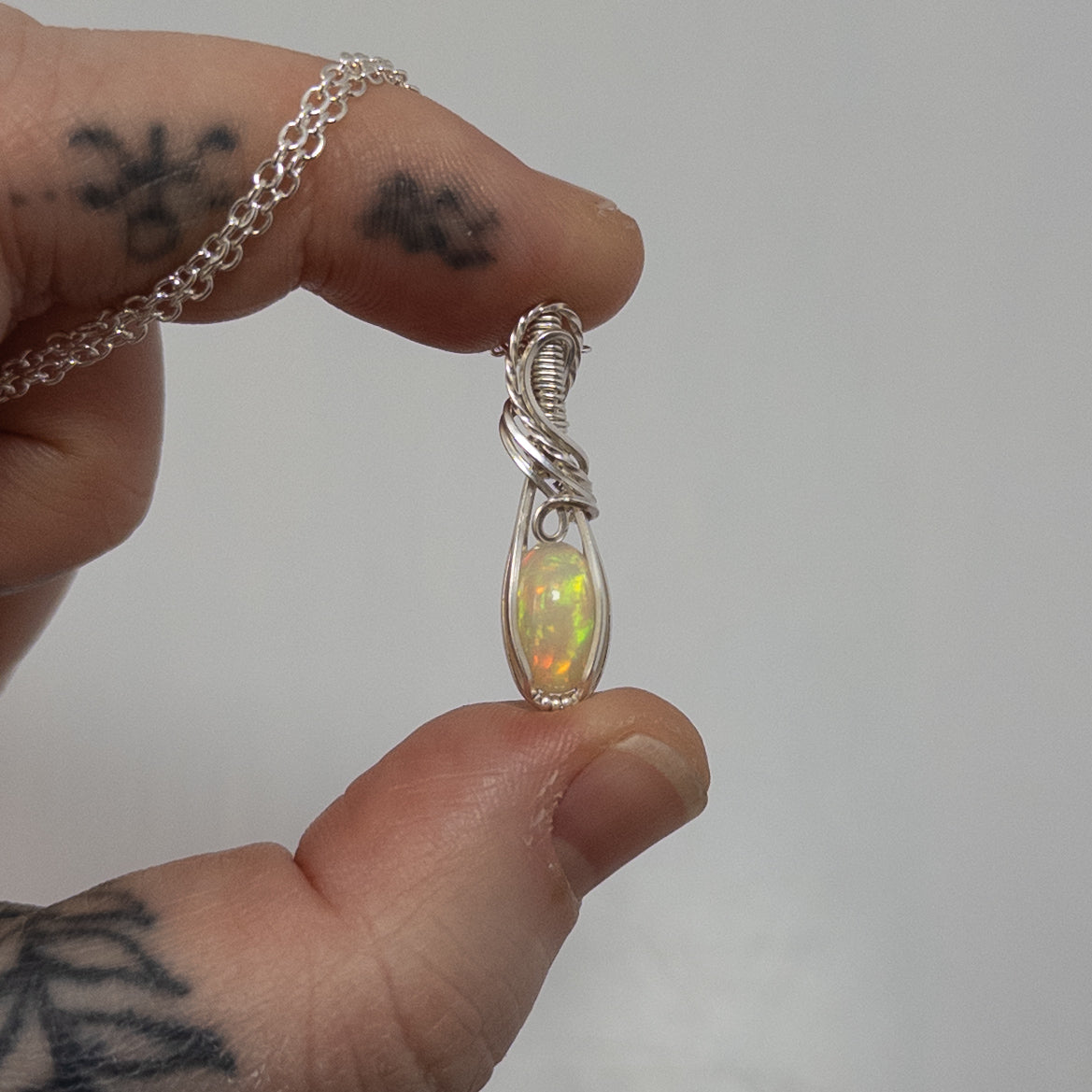 1.5 Carat Ethiopian Opal Sterling Silver Wrapped Pendant
