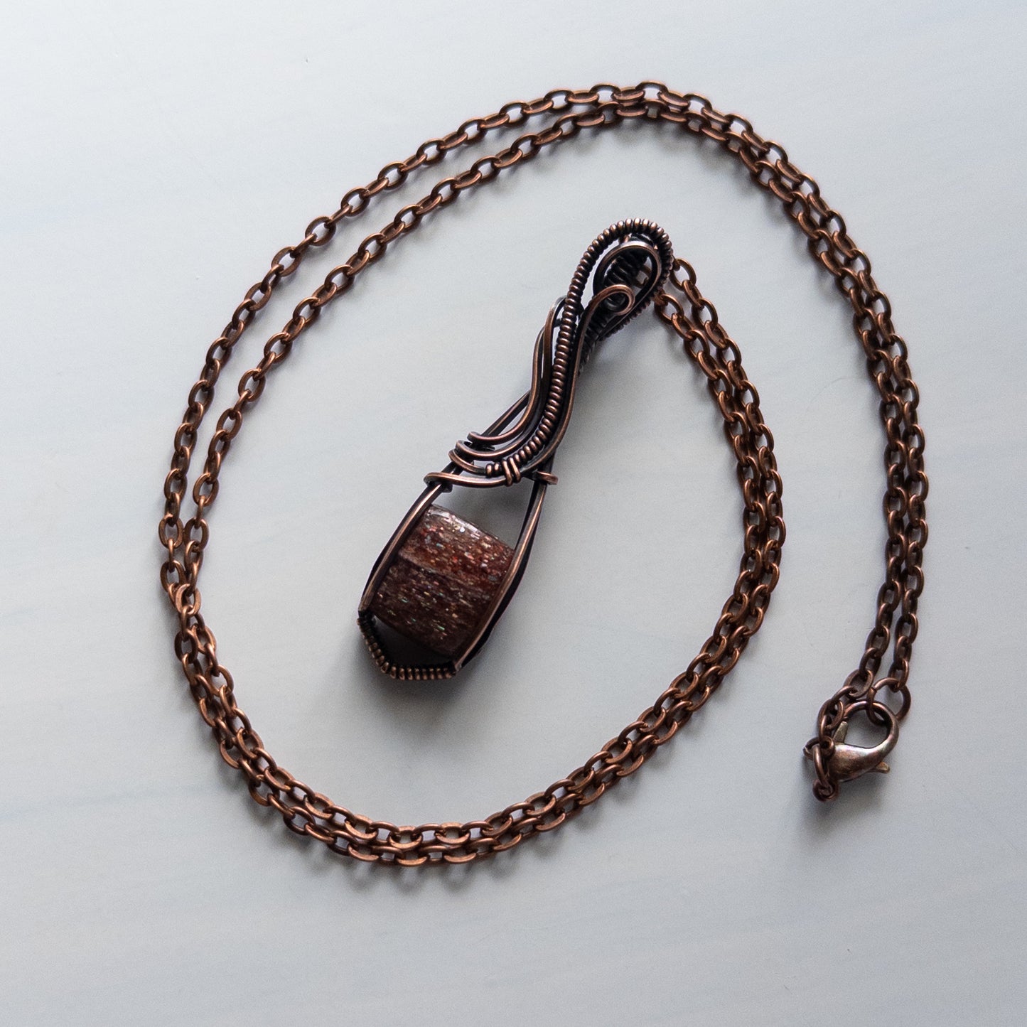Bloodshot Iolite Sunstone Antiqued Copper Wrapped Pendant