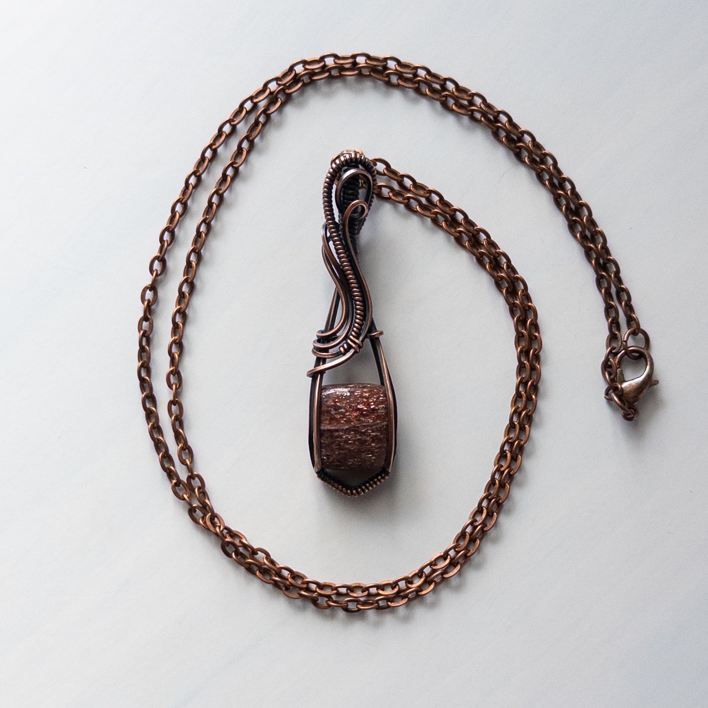 Bloodshot Iolite Sunstone Antiqued Copper Wrapped Pendant
