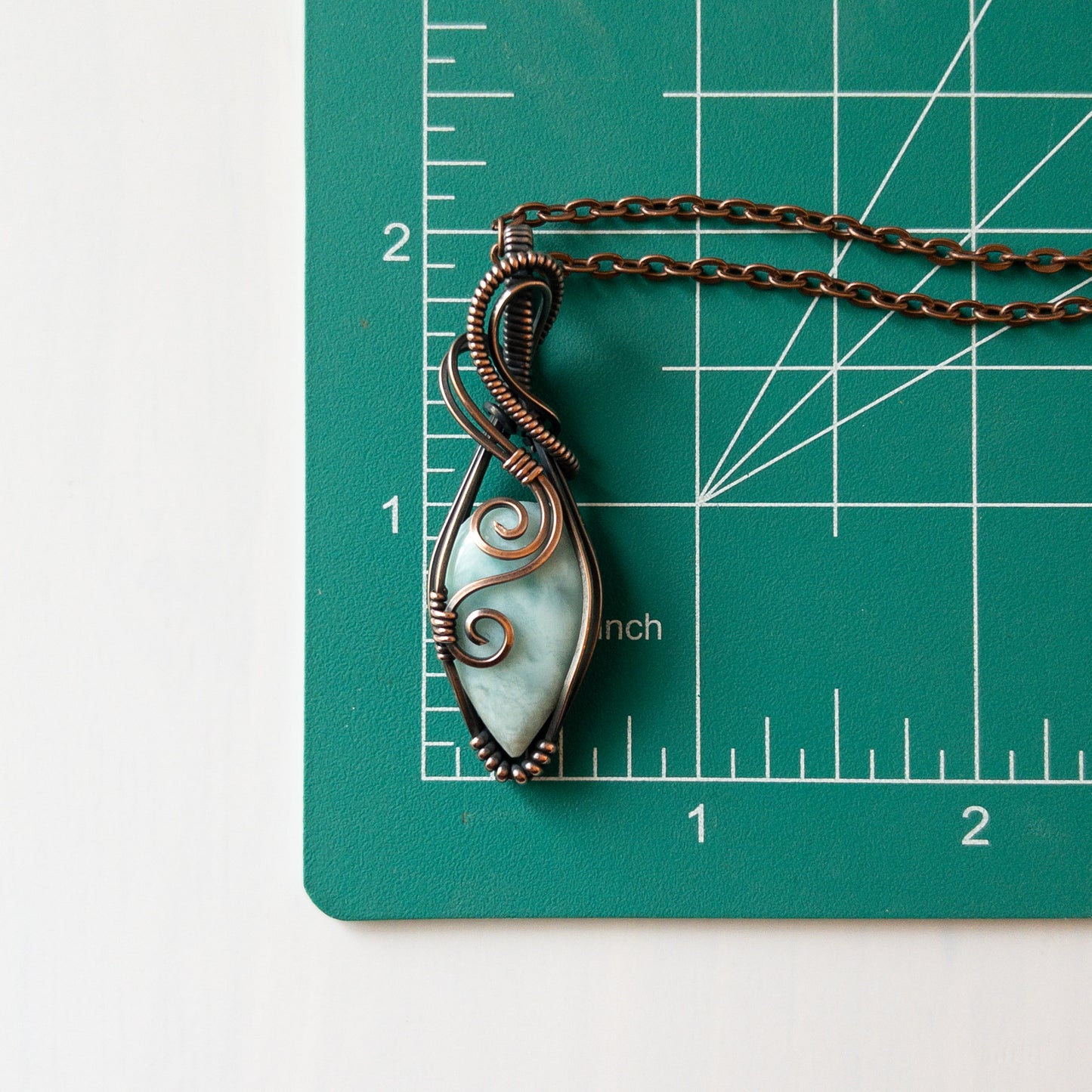 Larimar & Copper Wrapped Pendant With Swirl Motif
