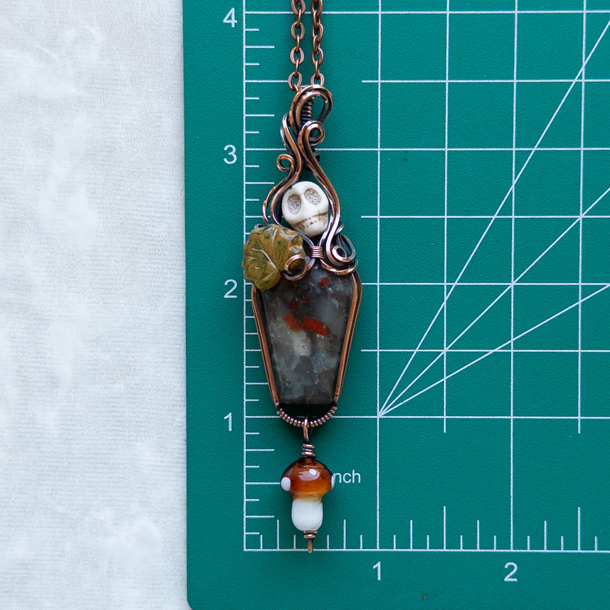 African Bloodstone Coffin Antiqued Copper Pendant With Skull, Leaf, & Dangling Glass Mushroom