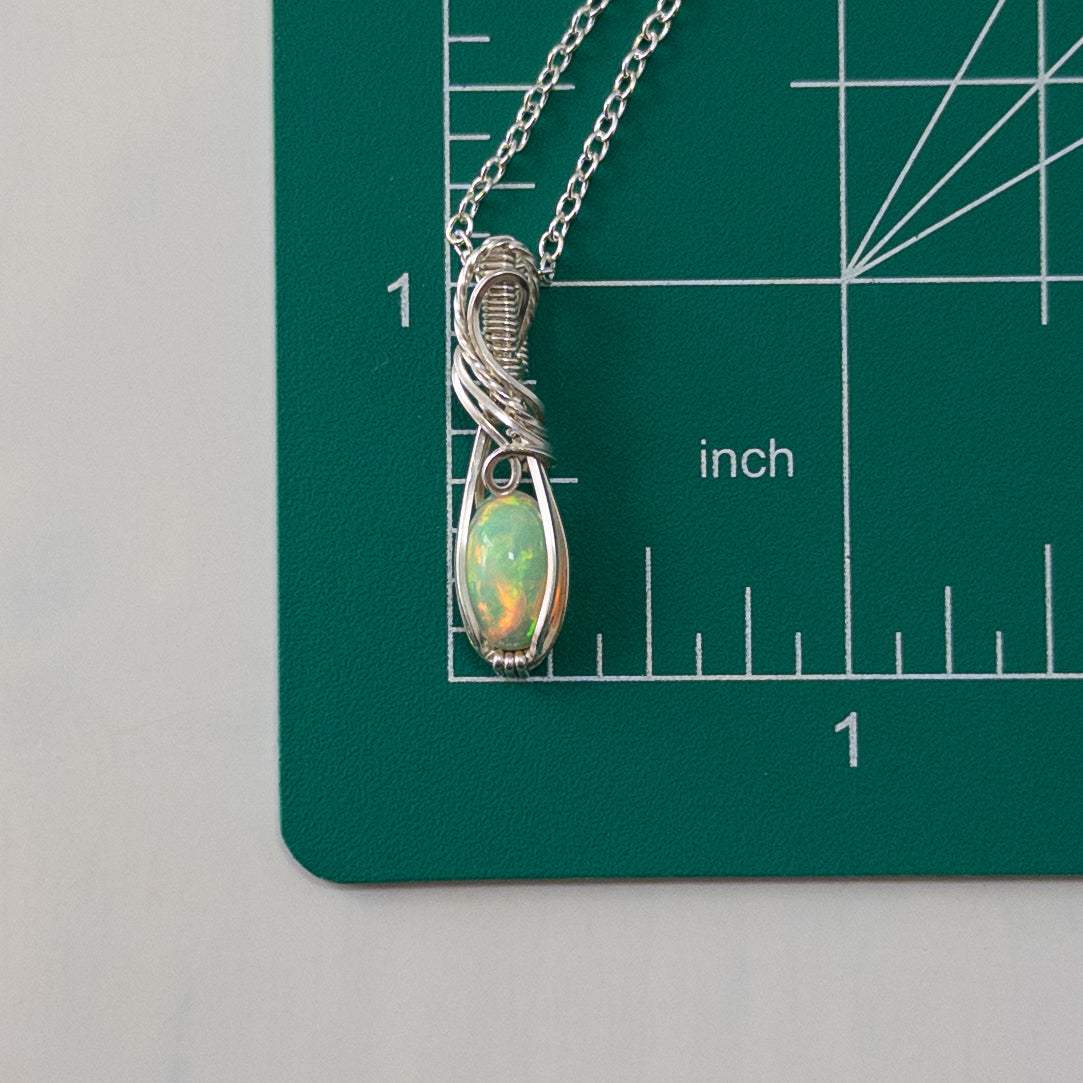 1.5 Carat Ethiopian Opal Sterling Silver Wrapped Pendant