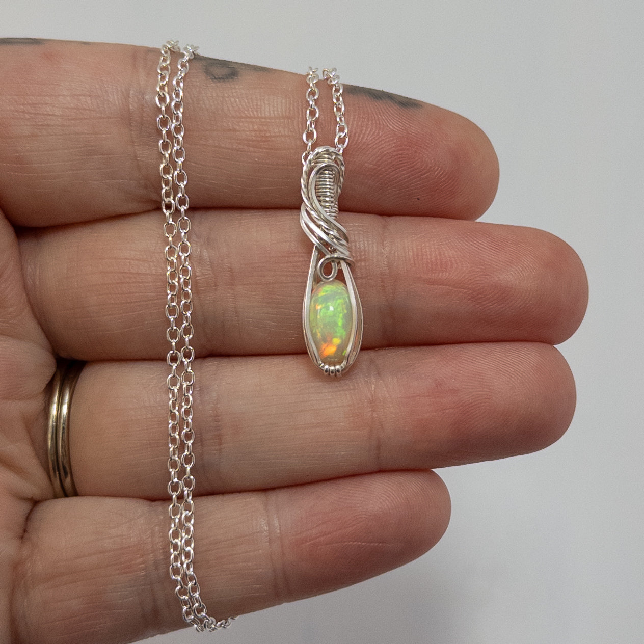 1.5 Carat Ethiopian Opal Sterling Silver Wrapped Pendant