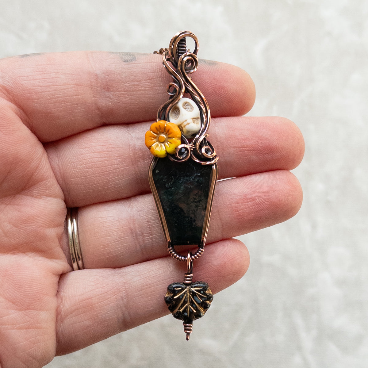 Moss Agate Coffin, Skull, & Marigold Antiqued Copper Pendant With Dangling Czech Glass Leaf