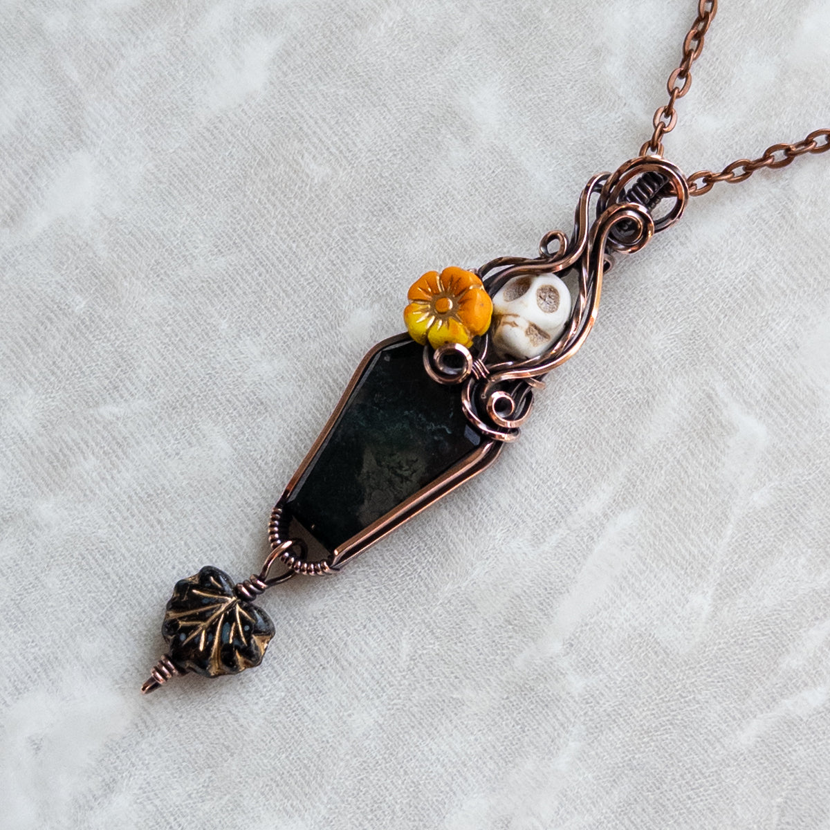 Moss Agate Coffin, Skull, & Marigold Antiqued Copper Pendant With Dangling Czech Glass Leaf