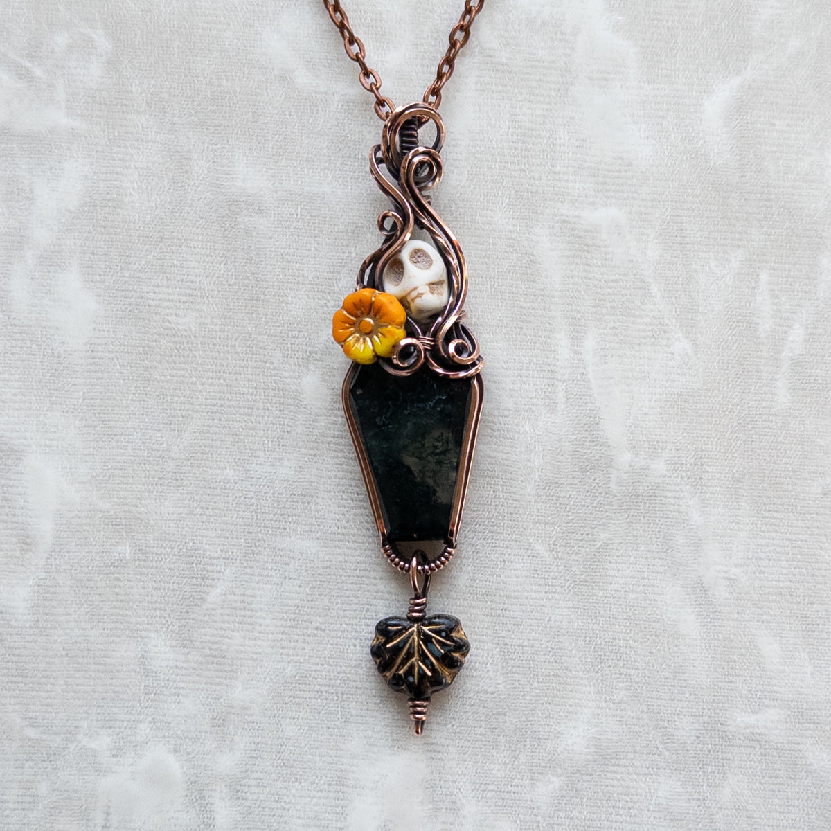 Moss Agate Coffin, Skull, & Marigold Antiqued Copper Pendant With Dangling Czech Glass Leaf