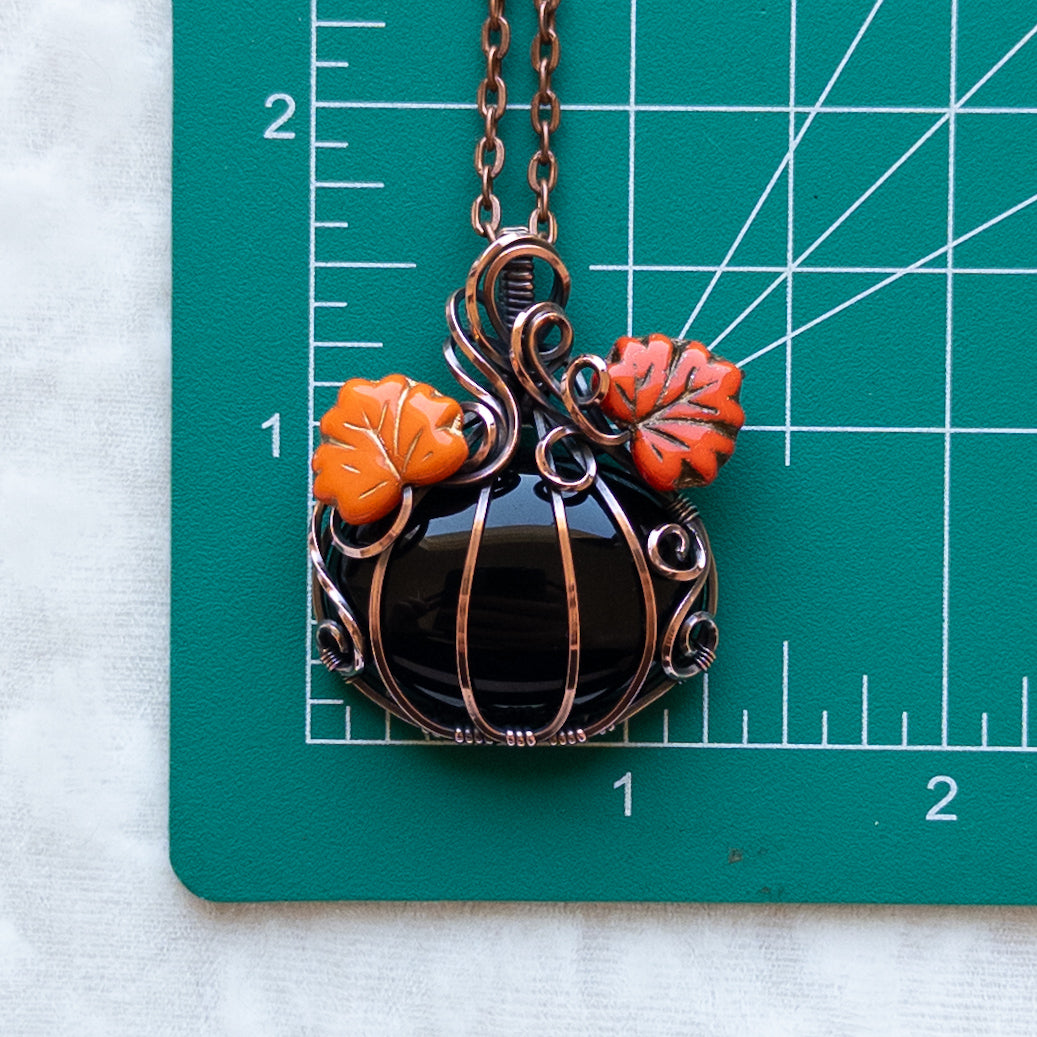 Black Onyx Antiqued Copper Pumpkin Pendant With Orange Leaves