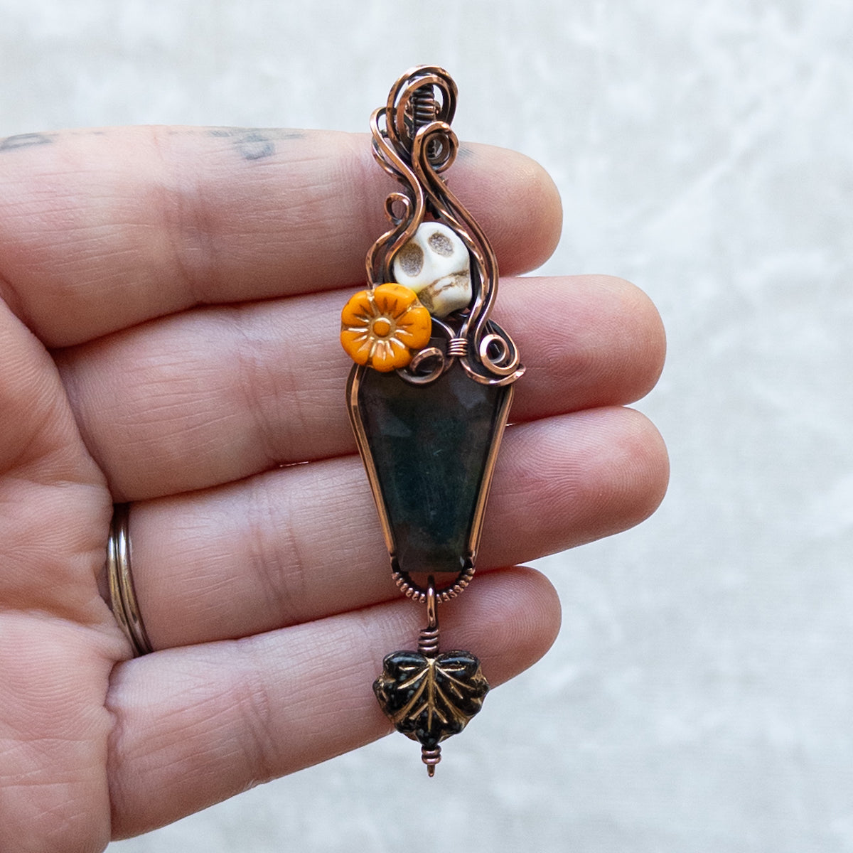 Moss Agate Coffin, Skull, & Marigold Antiqued Copper Pendant With Dangling Leaf