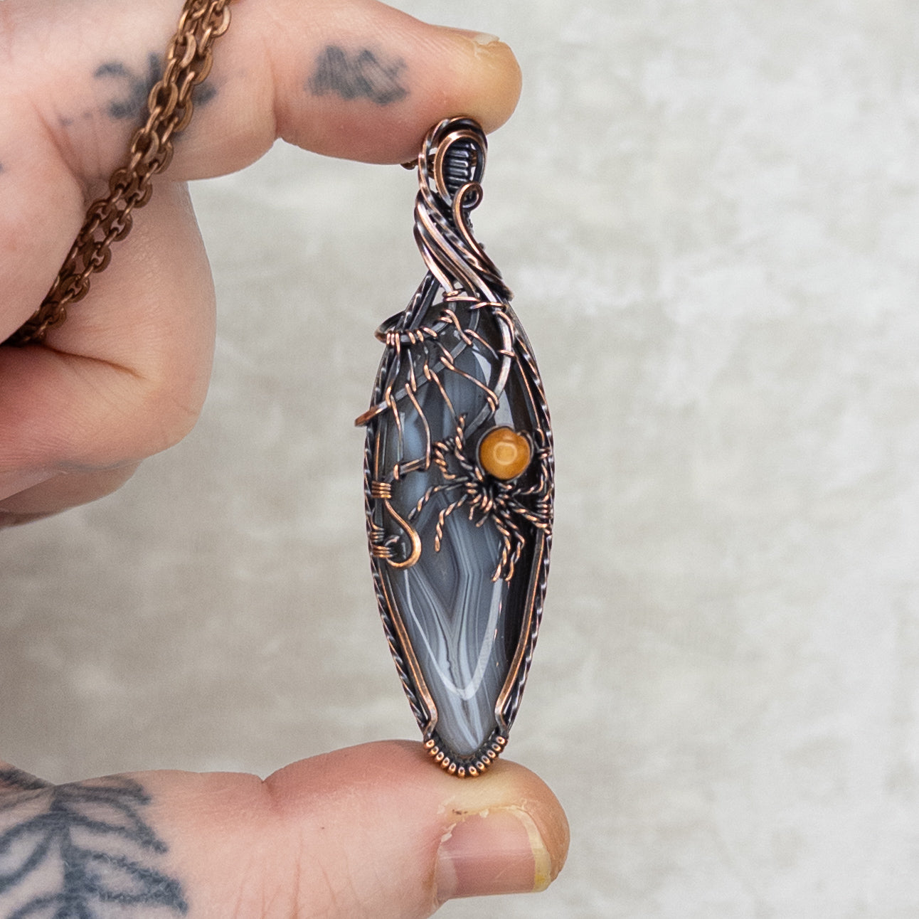 Botswana Agate Spider Web Antiqued Copper Pendant With Orange Aventurine Spider