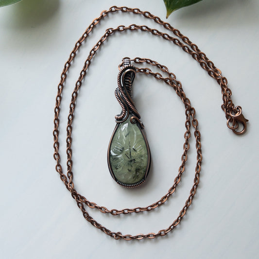 Prehnite With Carved Flower Motif & Copper Wrapped Pendant