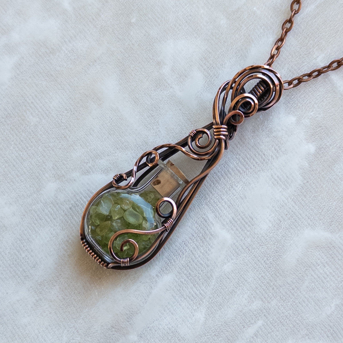 Peridot Filled Glass Bottle Antiqued Copper Pendant
