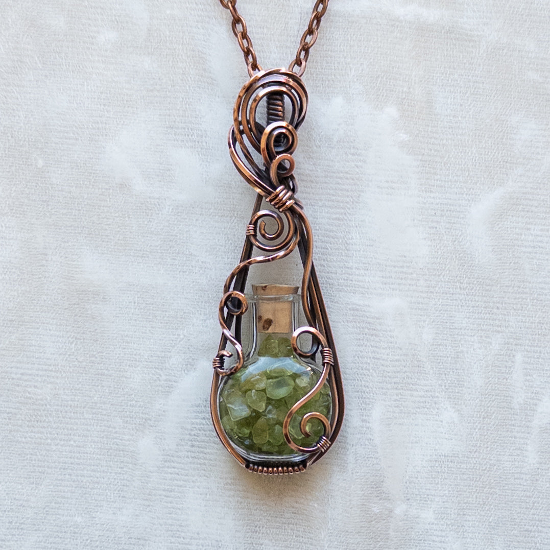 Peridot Filled Glass Bottle Antiqued Copper Pendant