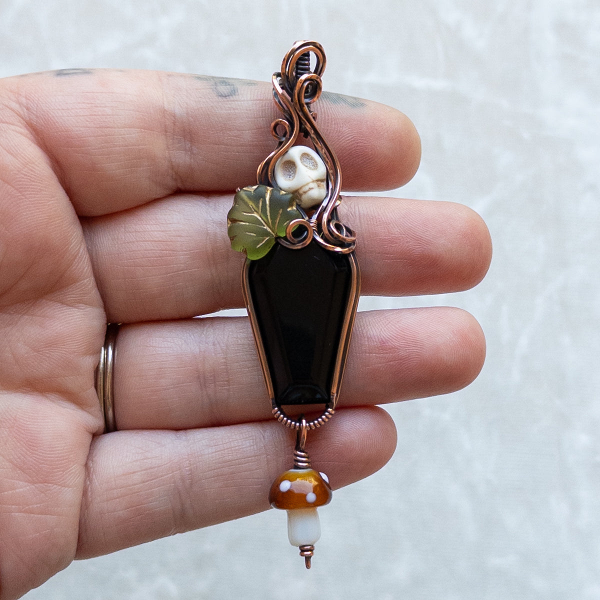 Obsidian Coffin Antiqued Copper Pendant With Skull, Leaf, & Dangling Glass Mushroom