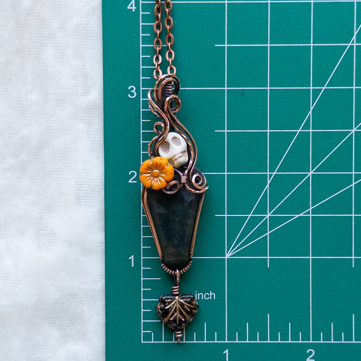 Moss Agate Coffin, Skull, & Marigold Antiqued Copper Pendant With Dangling Leaf