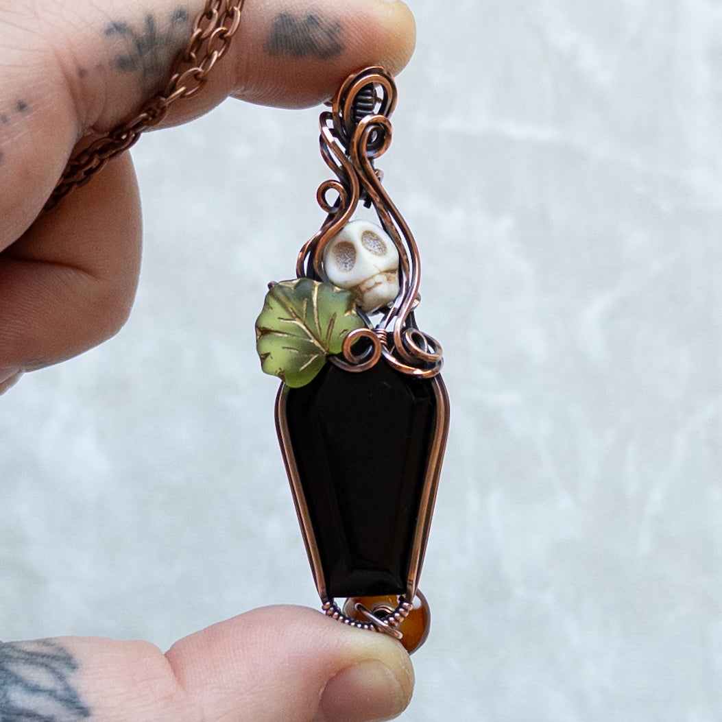 Obsidian Coffin Antiqued Copper Pendant With Skull, Leaf, & Dangling Glass Mushroom