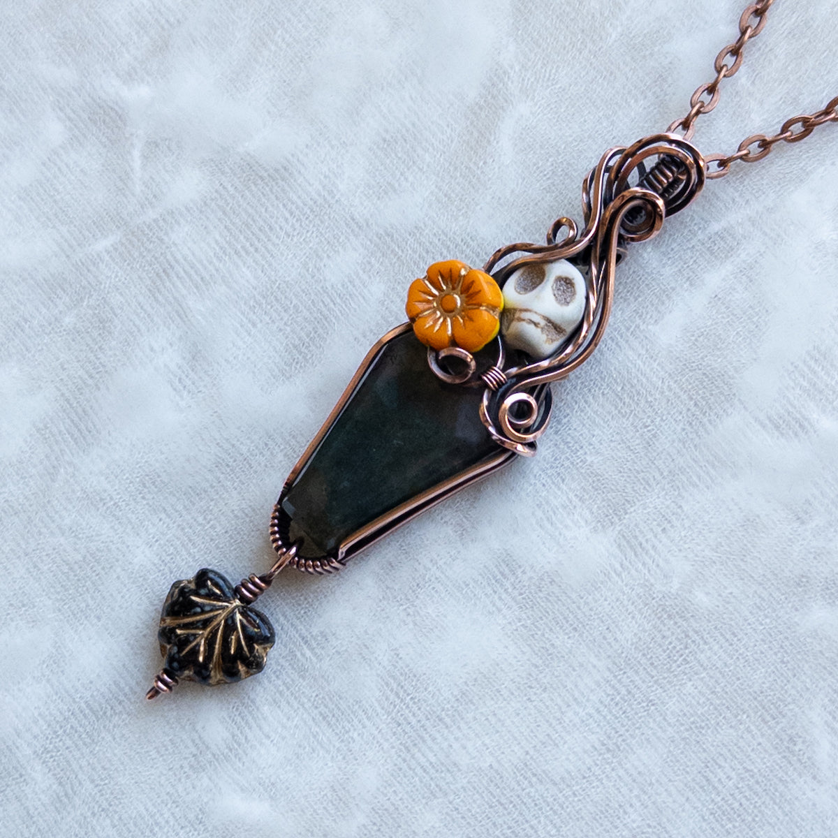 Moss Agate Coffin, Skull, & Marigold Antiqued Copper Pendant With Dangling Leaf
