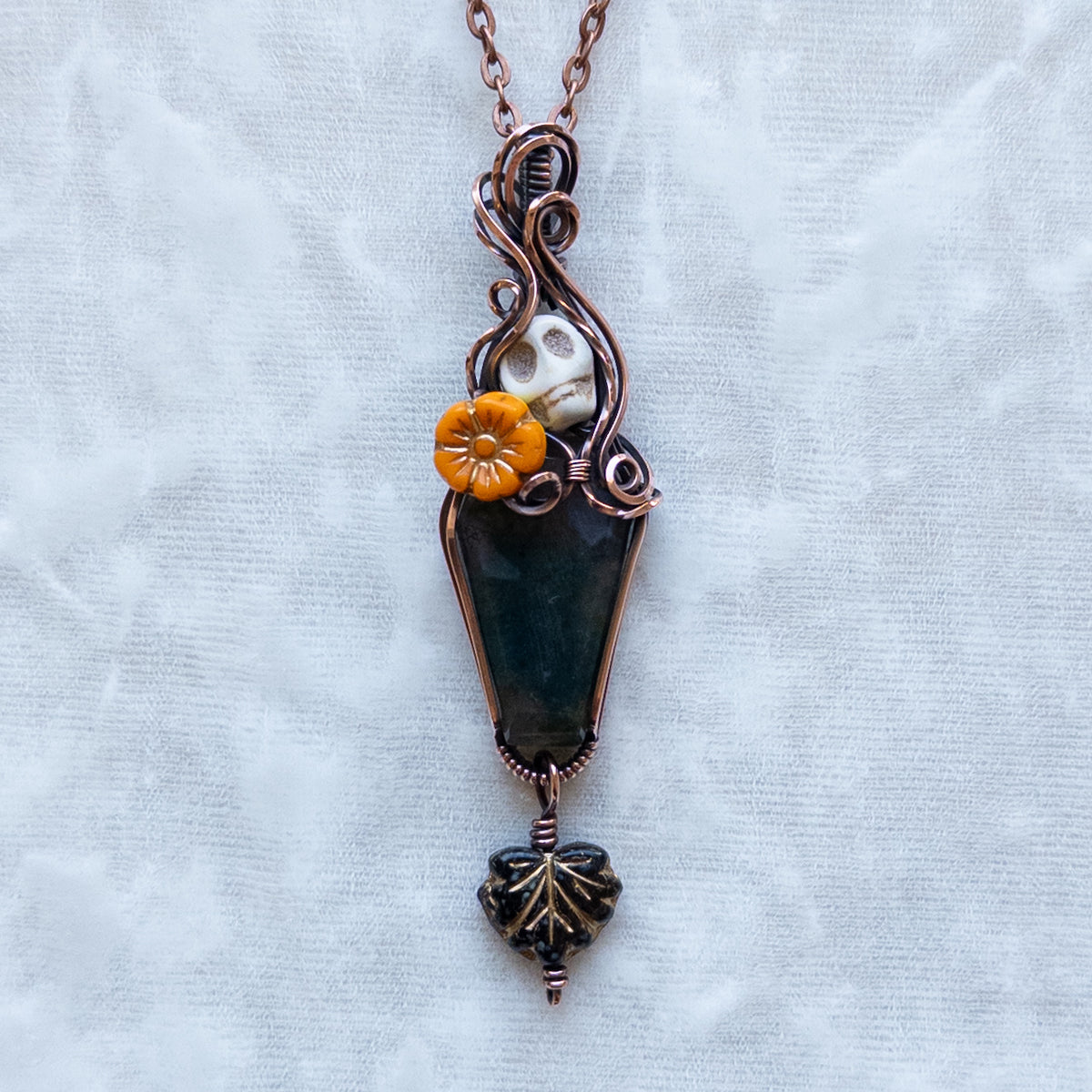 Moss Agate Coffin, Skull, & Marigold Antiqued Copper Pendant With Dangling Leaf