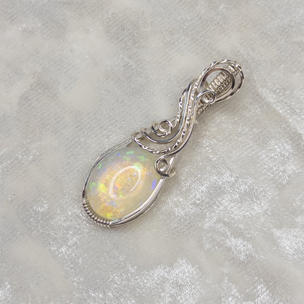 7.8ct. Welo Opal & .925 Sterling Silver Pendant