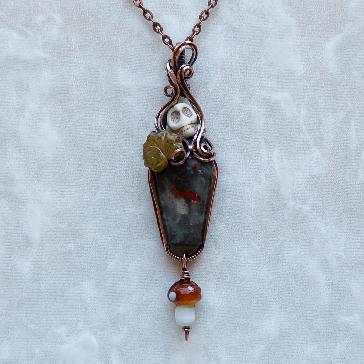 African Bloodstone Coffin Antiqued Copper Pendant With Skull, Leaf, & Dangling Glass Mushroom