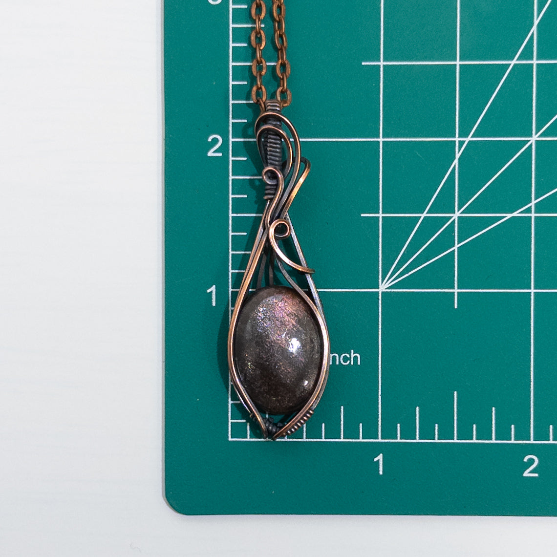 Purple Haze Sunstone Copper Wrapped Pendant