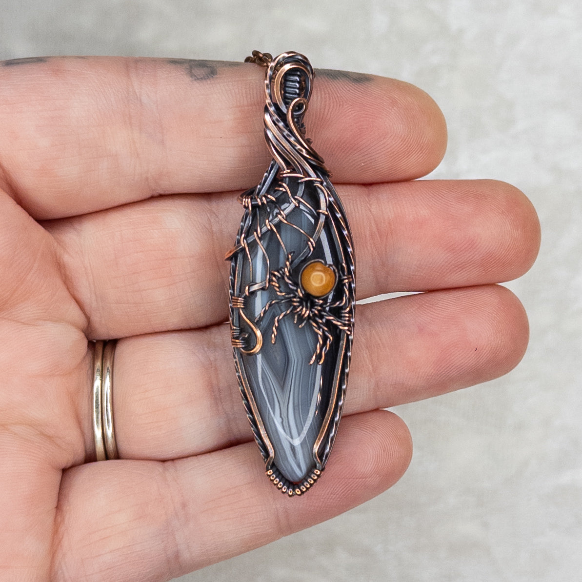 Botswana Agate Spider Web Antiqued Copper Pendant With Orange Aventurine Spider