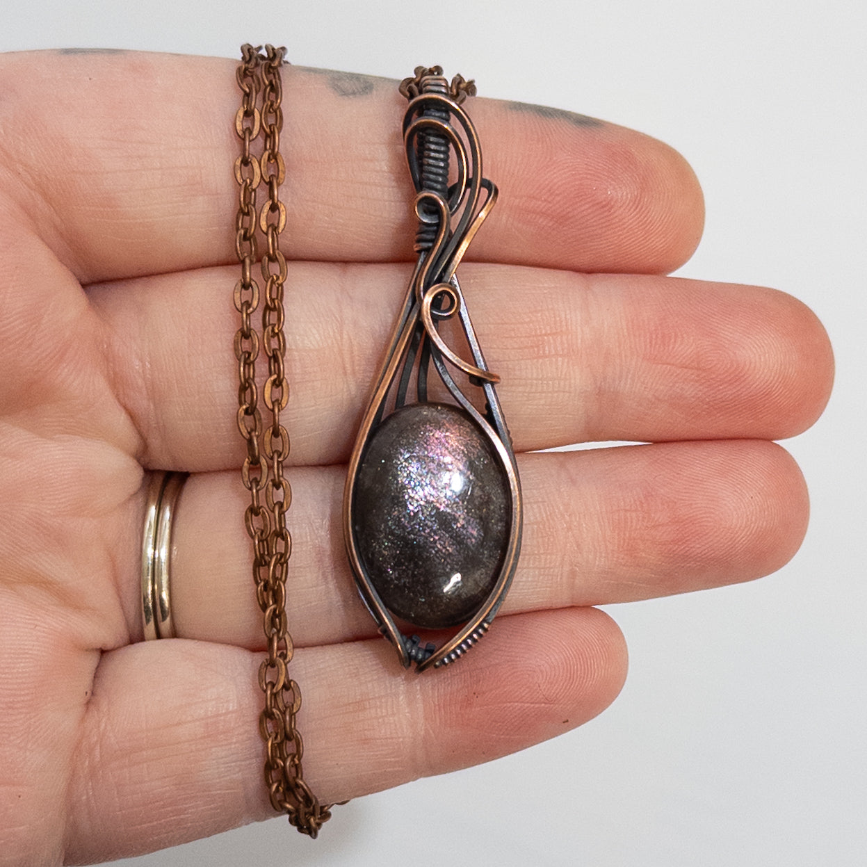 Purple Haze Sunstone Copper Wrapped Pendant