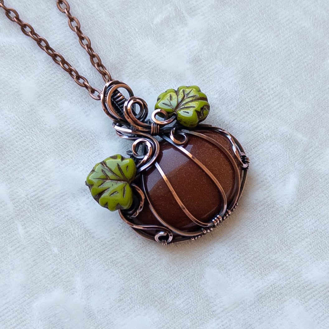 Orange Goldstone Antiqued Copper Pumpkin Pendant With Czech Glass Leaves