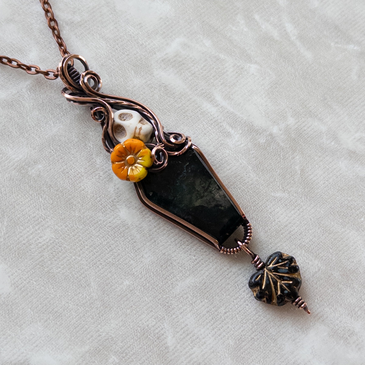 Moss Agate Coffin, Skull, & Marigold Antiqued Copper Pendant With Dangling Czech Glass Leaf