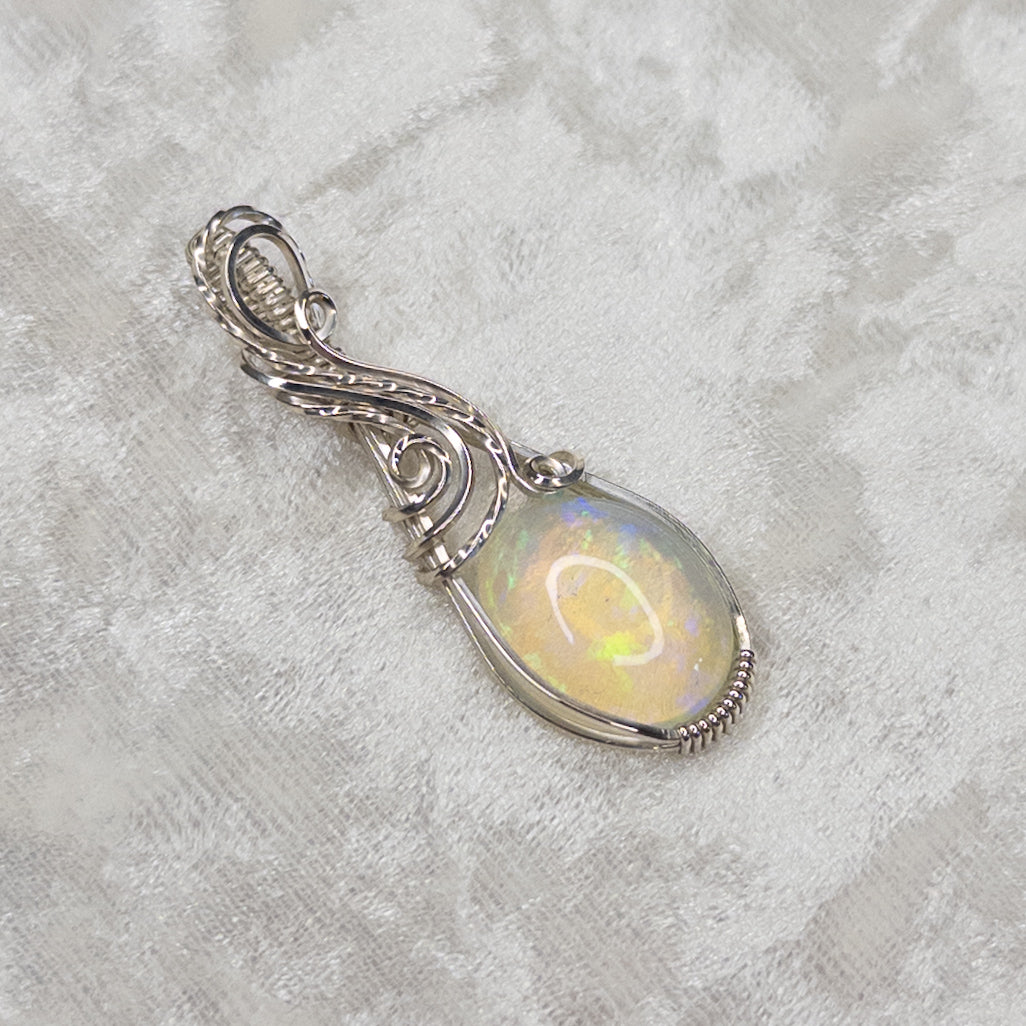7.8ct. Welo Opal & .925 Sterling Silver Pendant