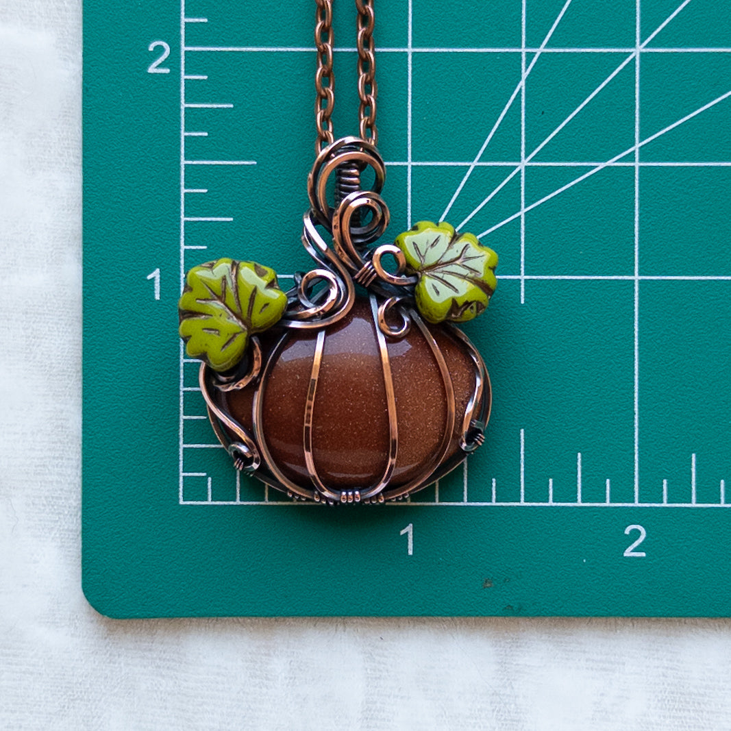 Orange Goldstone Antiqued Copper Pumpkin Pendant With Czech Glass Leaves