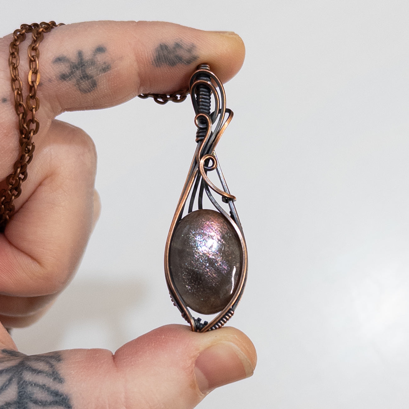 Purple Haze Sunstone Copper Wrapped Pendant