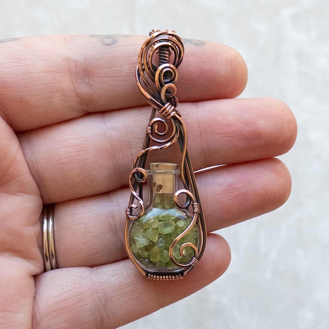 Peridot Filled Glass Bottle Antiqued Copper Pendant