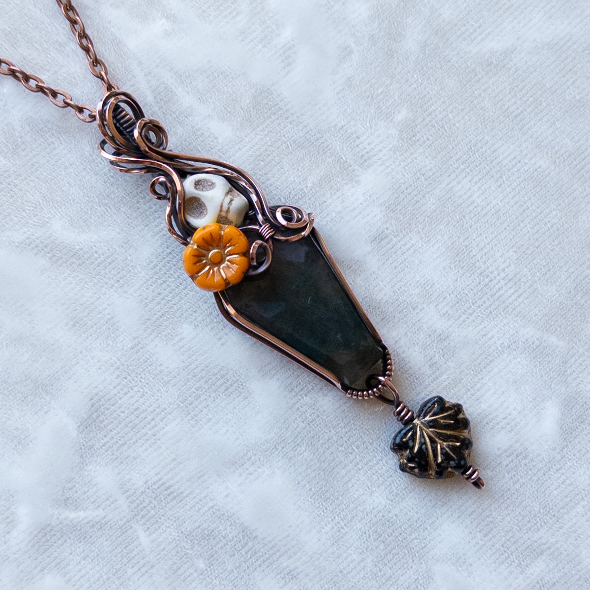 Moss Agate Coffin, Skull, & Marigold Antiqued Copper Pendant With Dangling Leaf