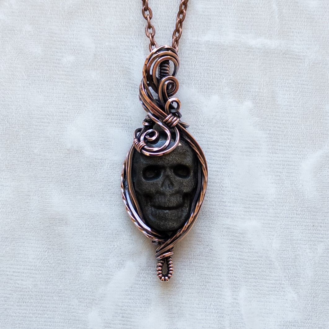 Silver/Gold Sheen Obsidian Skull Antiqued Copper Pendant