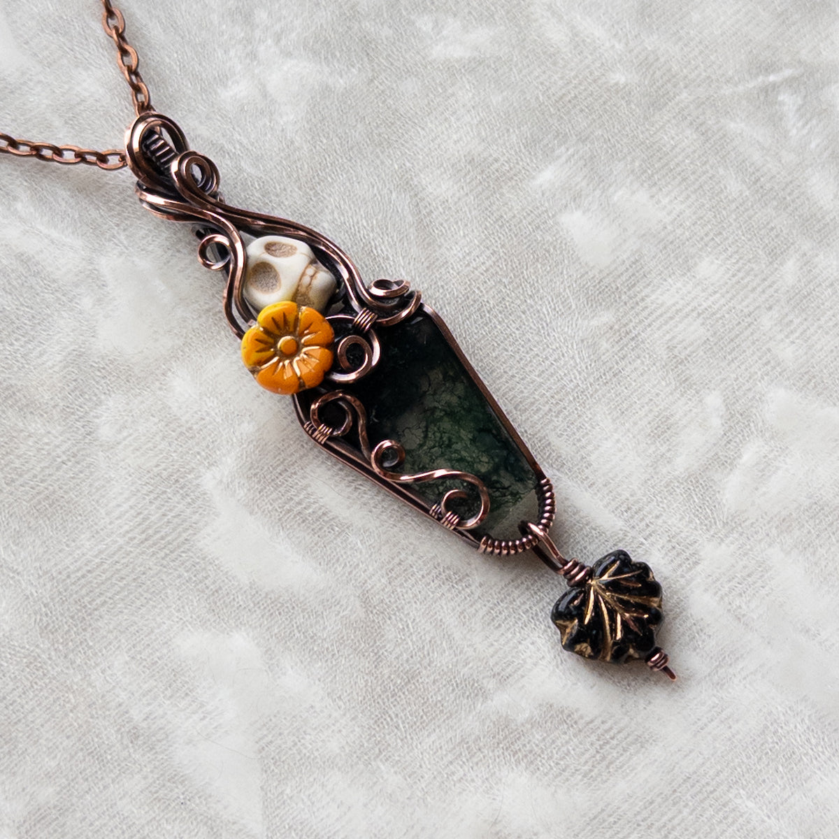 Moss Agate Coffin, Skull, & Marigold Antiqued Copper Pendant With Dangling Czech Glass Leaf