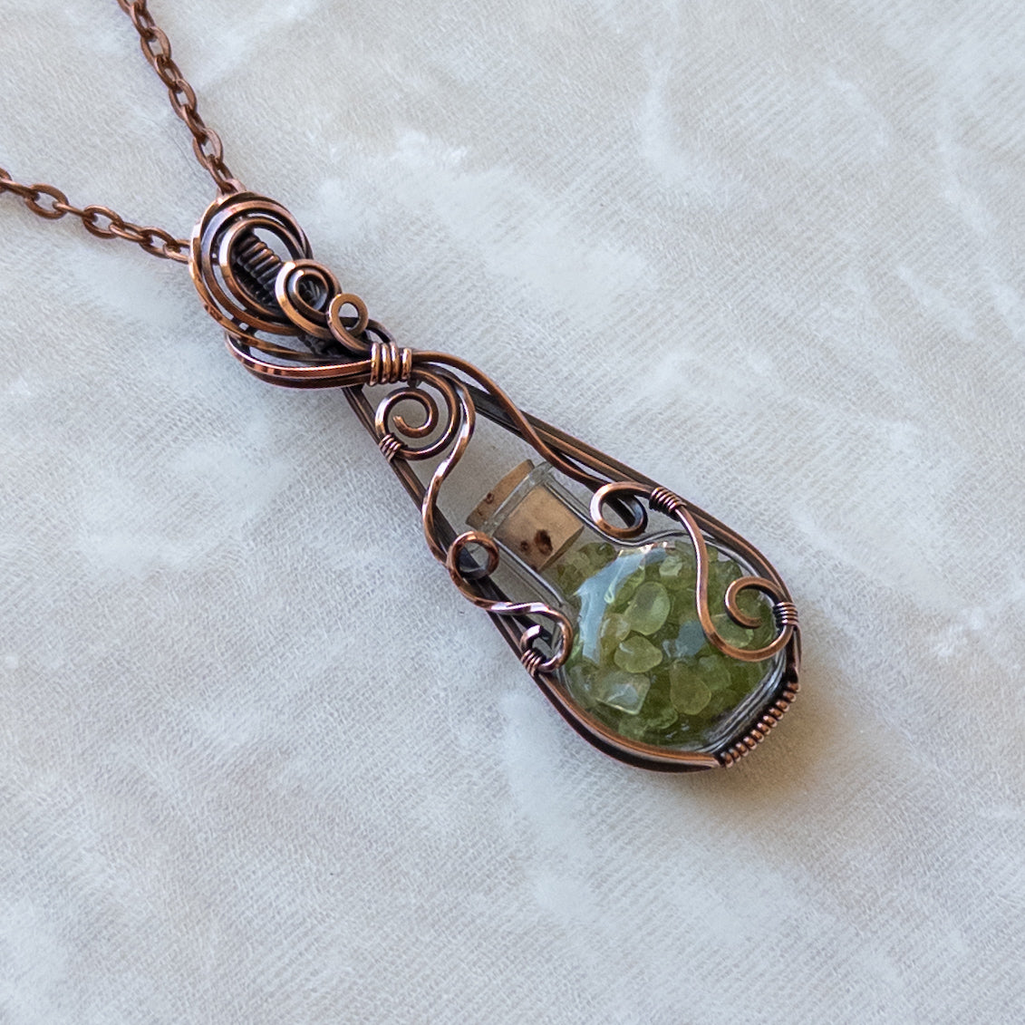 Peridot Filled Glass Bottle Antiqued Copper Pendant