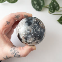 Load image into Gallery viewer, Dyed Black Flower Agate Sphere (2.54 in.)
